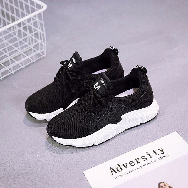 Women Lace Up Tennis Shoes